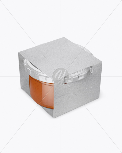 Clear Glass Sauce Jar in Kraft Paperboard Sleeve Mockup - Half Side View Clear Glass Sauce Jar in Kraft Paperboard Sleeve Mockup - Half Side View