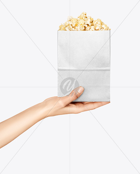 Paper Package w/ Popcorn in a Hand Mockup