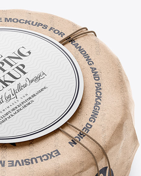 Cheese Wheel Wrapped In Kraft Paper Mockup