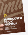 Leather Hardcover Book in a Hand Mockup