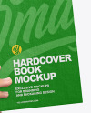 Fabric Hardcover Book in a Hand Mockup