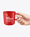 Glossy Mug in a Hand Mockup