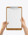 Wooden Clipboard with A4 Paper in Hands Mockup