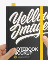 Notebook in a Hand Mockup