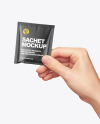 Glossy Sachet in a Hand Mockup