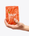 Glossy Food Bag in a Hand Mockup