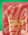 Glossy Food Bag in a Hand Mockup