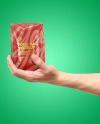 Glossy Food Bag in a Hand Mockup