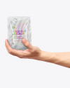 Glossy Food Bag in a Hand Mockup