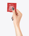 Matte Square Condom Packaging in a Hand Mockup