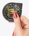 Glossy Condom Packaging in a Hand Mockup