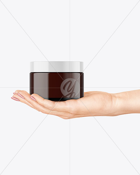 Amber Glass Cosmetic Jar in a Hand Mockup