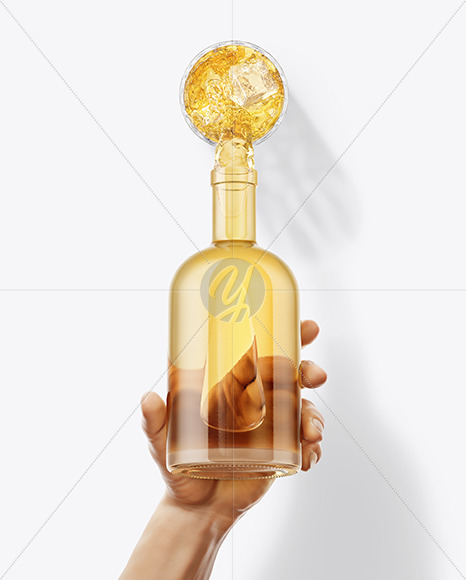 Tequila Bottle in the Hand Mockup