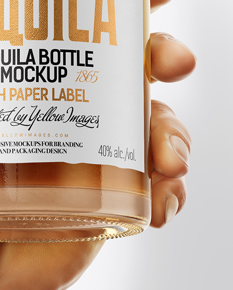 Tequila Bottle in the Hand Mockup