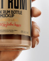 Black Rum Bottle in the Hand Mockup