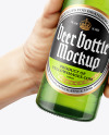 Two Green Glass Beer Bottles in the Hands Mockup