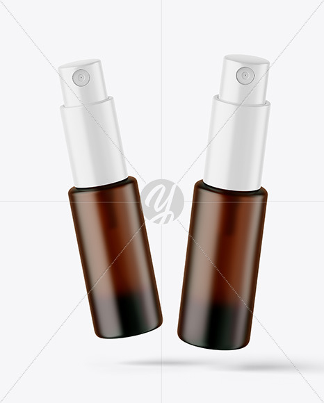 Two Frosted Amber Glass Spray Bottles Mockup