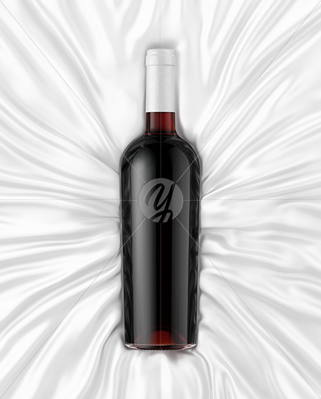 Clear Glass Red Wine Bottle Lying on a Silk Cloth Mockup