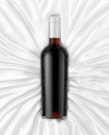 Clear Glass Red Wine Bottle Lying on a Silk Cloth Mockup