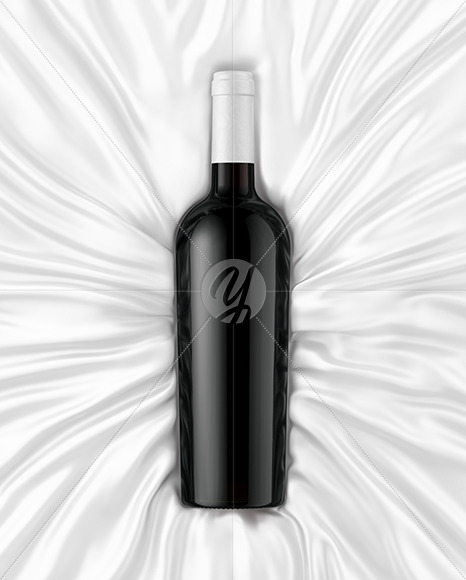 Green Glass Red Wine Bottle Lying on a Silk Cloth Mockup