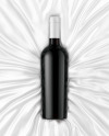 Green Glass Red Wine Bottle Lying on a Silk Cloth Mockup