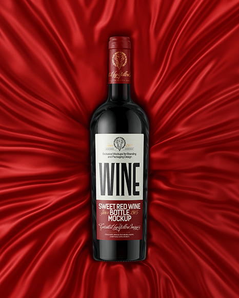 Green Glass Red Wine Bottle Lying on a Silk Cloth Mockup