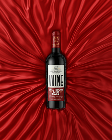 Green Glass Red Wine Bottle Lying on a Silk Cloth Mockup