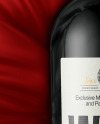 Green Glass Red Wine Bottle Lying on a Silk Cloth Mockup