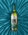 Green Glass White Wine Bottle Lying on a Silk Cloth Mockup