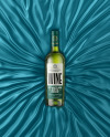 Green Glass White Wine Bottle Lying on a Silk Cloth Mockup