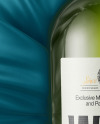 Green Glass White Wine Bottle Lying on a Silk Cloth Mockup