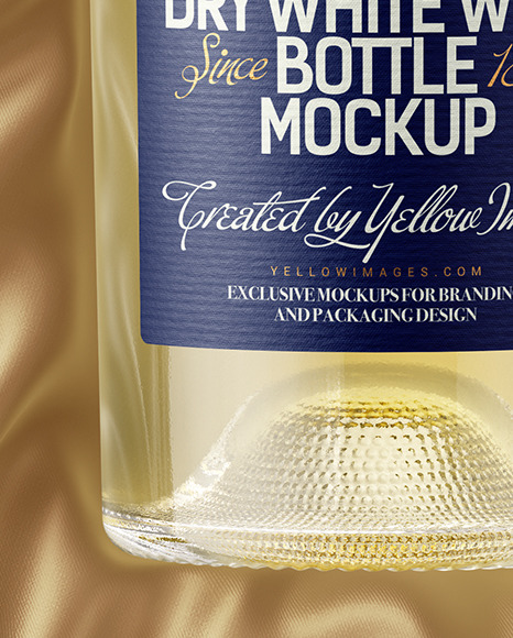 Clear Glass White Wine Bottle Lying on a Silk Cloth Mockup