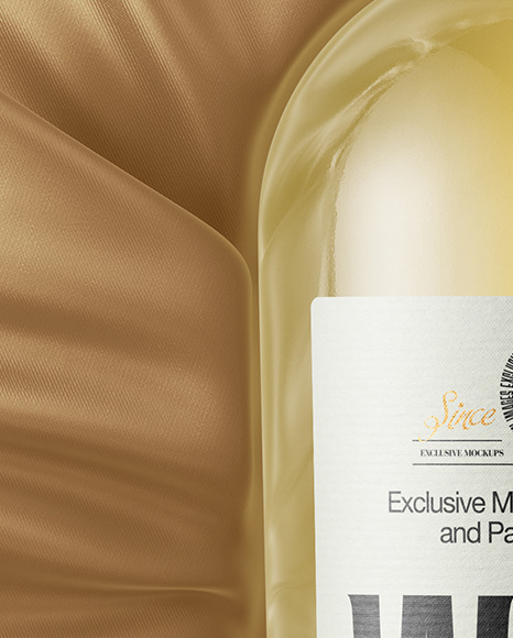 Clear Glass White Wine Bottle Lying on a Silk Cloth Mockup