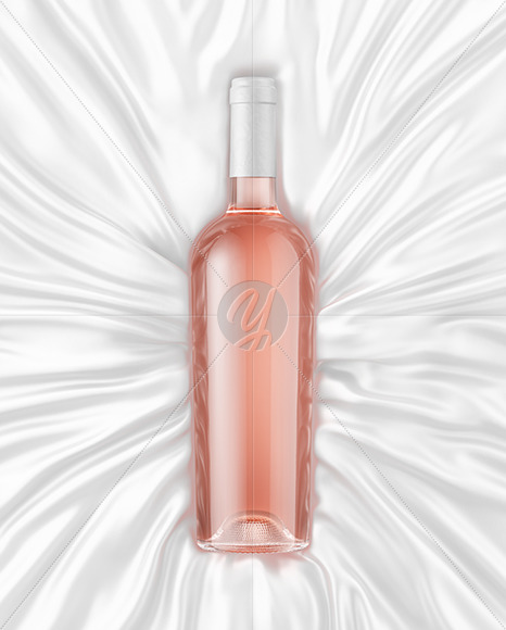 Clear Glass Pink Wine Bottle Lying on a Silk Cloth Mockup