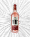 Clear Glass Pink Wine Bottle Lying on a Silk Cloth Mockup