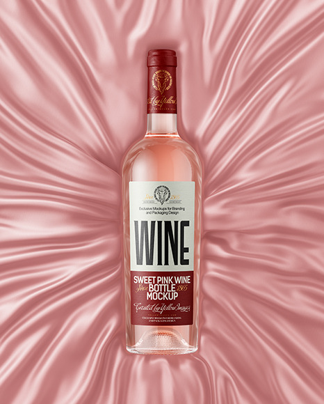 Clear Glass Pink Wine Bottle Lying on a Silk Cloth Mockup