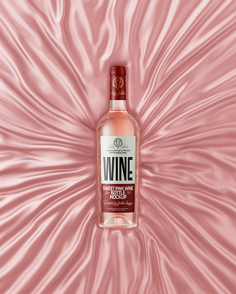 Clear Glass Pink Wine Bottle Lying on a Silk Cloth Mockup