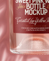 Clear Glass Pink Wine Bottle Lying on a Silk Cloth Mockup