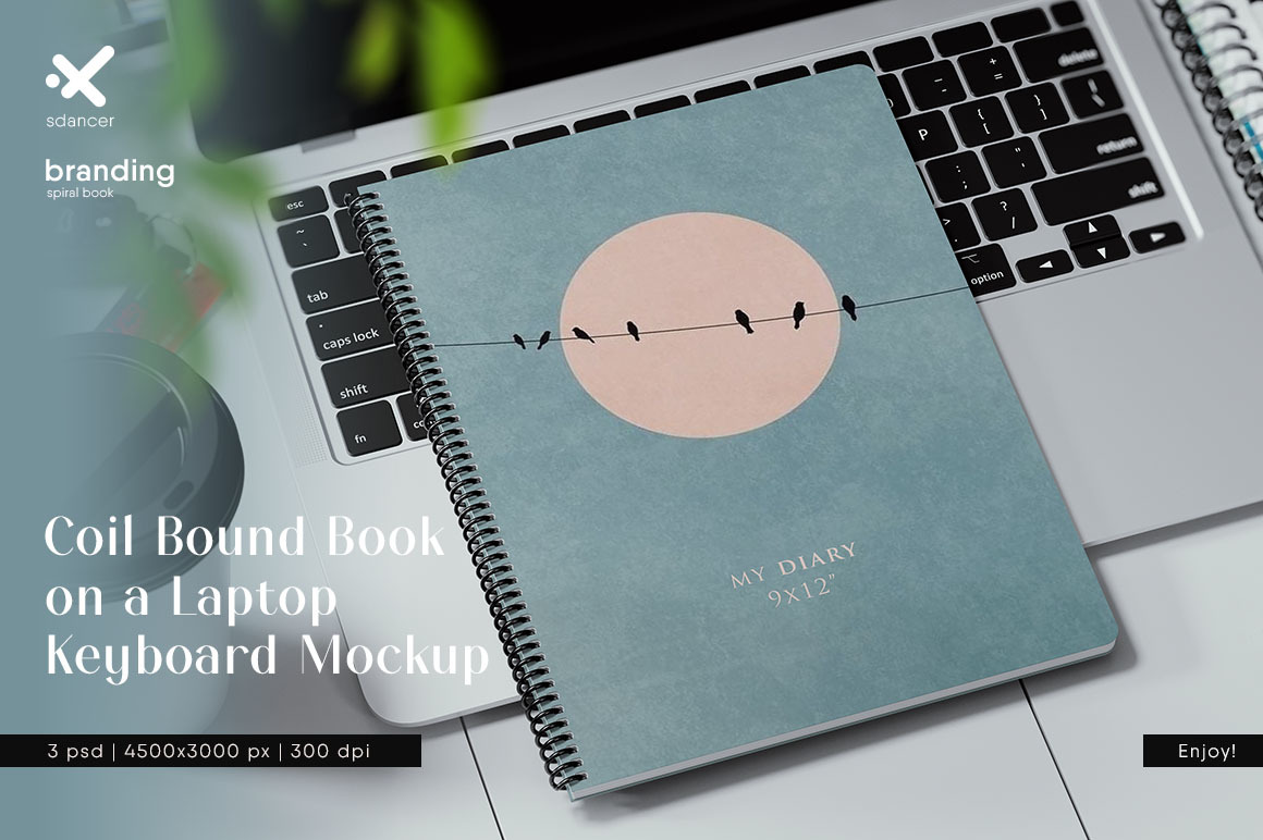 Coil Bound Book on a Laptop Keyboard Mockup Coil Bound Book on a Laptop Keyboard Mockup