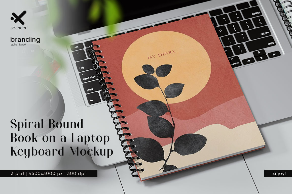Spiral Bound Book on a Laptop Keyboard Mockup Spiral Bound Book on a Laptop Keyboard Mockup