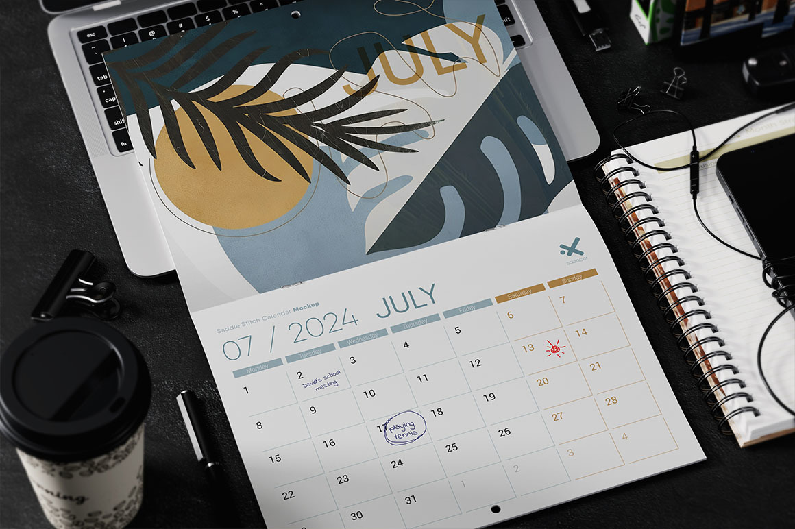 Saddle Stitch Calendar on Laptop Mockup Saddle Stitch Calendar on Laptop Mockup