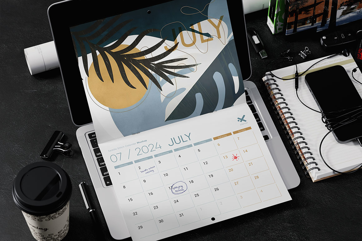 Saddle Stitch Calendar on Laptop Mockup Saddle Stitch Calendar on Laptop Mockup
