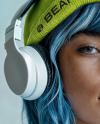 Woman Wearing a Beanie Hat and Headphones Mockup