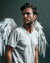 Man with Wings Wearing a T-Shirt Mockup