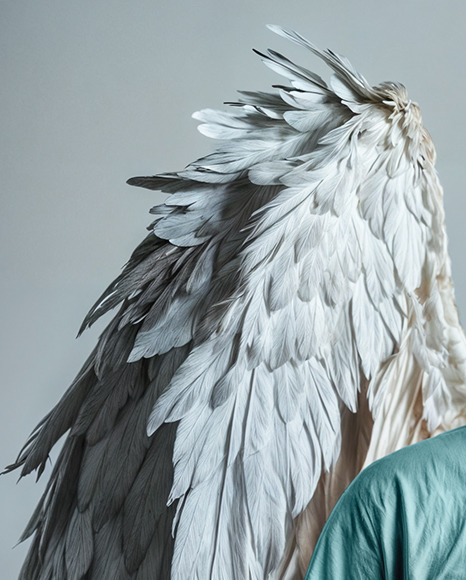 Man with Wings Wearing a T-Shirt Mockup