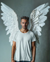 Man with Angel Wings Wearing a T-Shirt Mockup