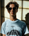 Male Model Wearing a T-Shirt and Sunglasses Mockup