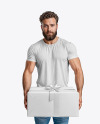 Bearded Man Wearing a Tight Fit T-Shirt Holds a Gift Box Mockup