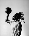 Black Man with Dreadlocks Holding a Ball & Wearing a T-Shirt Mockup