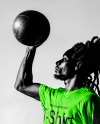 Black Man with Dreadlocks Holding a Ball & Wearing a T-Shirt Mockup